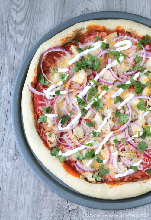 My favorite Tex-Mex flavors come together to make this easy Chicken Enchilada Pizza. Perfect for easy weeknight dinners! | This Gal Cooks