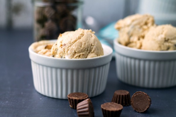 Fluffernutter Peanut Butter Cup Ice Cream. Homemade Ice Cream made with peanut butter, marshmallow fluff and peanut butter cups! From www.thisgalcooks.com #peanutbutter #icecream