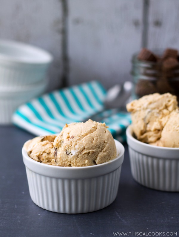 Fluffernutter Peanut Butter Cup Ice Cream. Homemade Ice Cream made with peanut butter, marshmallow fluff and peanut butter cups! From www.thisgalcooks.com #peanutbutter #icecream