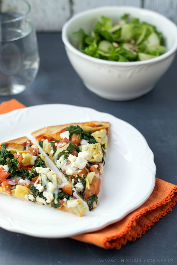 Healthy Tomato Spinach & Artichoke Pizza from www.thisgalcooks. This pizza is healthy, packed with flavor and super easy to make! #pizza #vegetarian 1wm