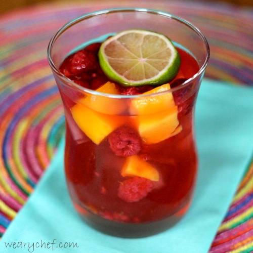 Very Pink Sangria with Raspberries and Mangoes by The Weary Chef