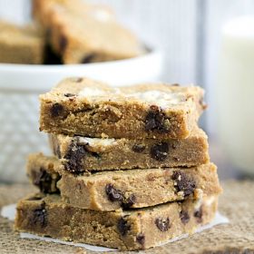 Chocolate Chip Peanut Butter Marshmallow Bars - This Gal Cooks for Blahnik Baker. Moist peanut butter cookie bars filled with chocoalte chips and marshmallows! #dessert #cookies