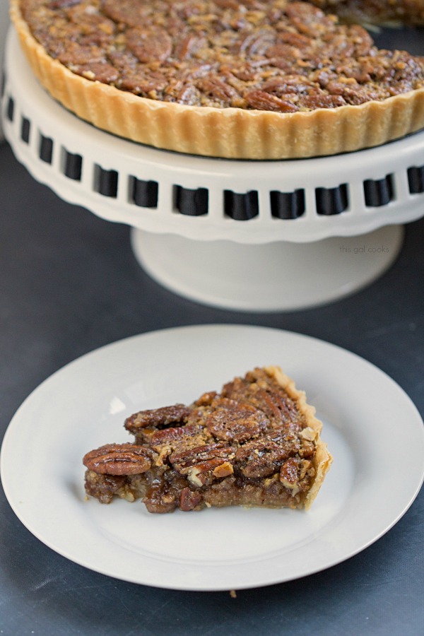 Classic Pecan Pie Tart - This Gal Cooks. This pecan pie is spiced up with the addition of cinnamon and spiced rum!