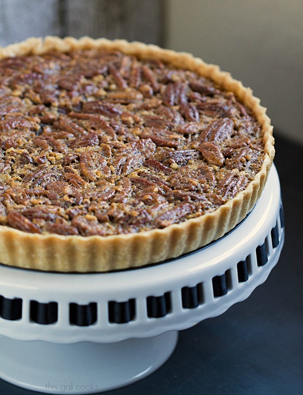 Classic Pecan Pie Tart - This Gal Cooks. This pecan pie is spiced up with the addition of cinnamon and spiced rum!