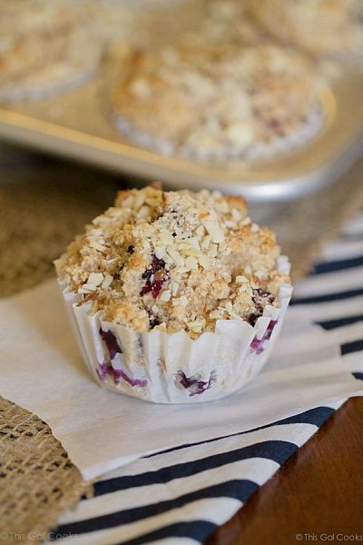 Healthier Blueberry Muffins - This Gal Cooks. Tasty muffins made with whole wheat, flax, honey, Greek Yogurt and blueberries. Topped with chopped almonds.