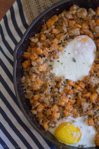 Sausage and Sweet Potato Hash with Baked Eggs - This Gal Cooks. A savory breakfast dish made with chicken sausage. #healthy #breakfast #sweetpotato