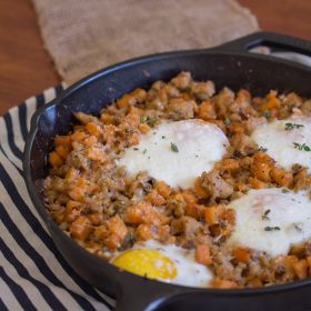 Sausage and Sweet Potato Hash with Baked Eggs - This Gal Cooks. A savory breakfast dish made with chicken sausage. #healthy #breakfast #sweetpotato