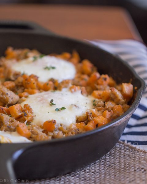 Sausage and Sweet Potato Hash with Baked Eggs - This Gal Cooks. A savory breakfast dish made with chicken sausage. #healthy #breakfast #sweetpotato