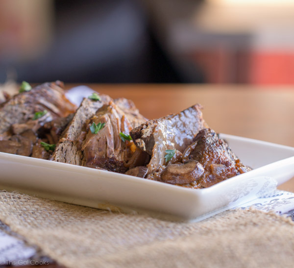 Crock Pot Beef Burgundy - This Gal Cooks. Tasty beef roast is seasoned, browned and slow cooked with red wine and onions to give you a hearty meal that the whole family will enjoy.