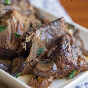Crock Pot Beef Burgundy - This Gal Cooks. Tasty beef roast is seasoned, browned and slow cooked with red wine and onions to give you a hearty meal that the whole family will enjoy.