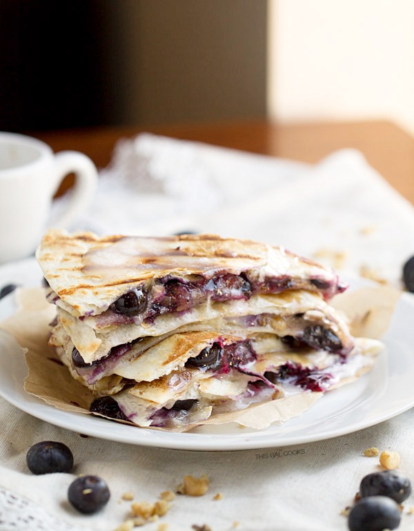 Creamy brie cheese, walnuts and fresh blueberries come together to make this crazy good Blueberry Brie Walnut Quesadilla. Perfect for breakfast or dessert!