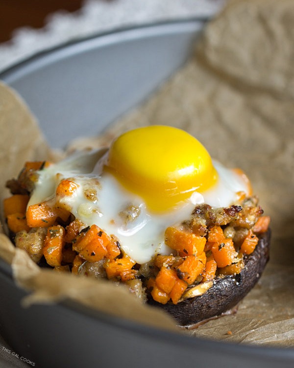 Sausage + Sweet Potato Stuffed Portobello: Chicken Sausage and diced sweet potatoes are sautéed in Italian seasonings, stuffed into  portabellos, topped with an egg and baked to perfection.