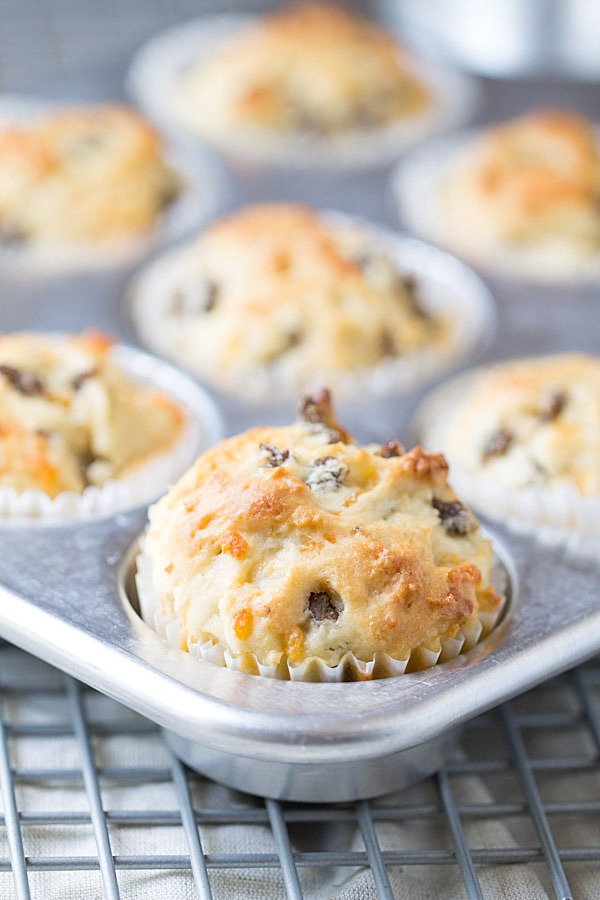 We LOVE to begin our day with these savory Sausage Cheddar and Olive Oil Muffins. Perfect for a quick breakfast or to enjoy with a cup of coffee! | This Gal Cooks #PantryInsiders