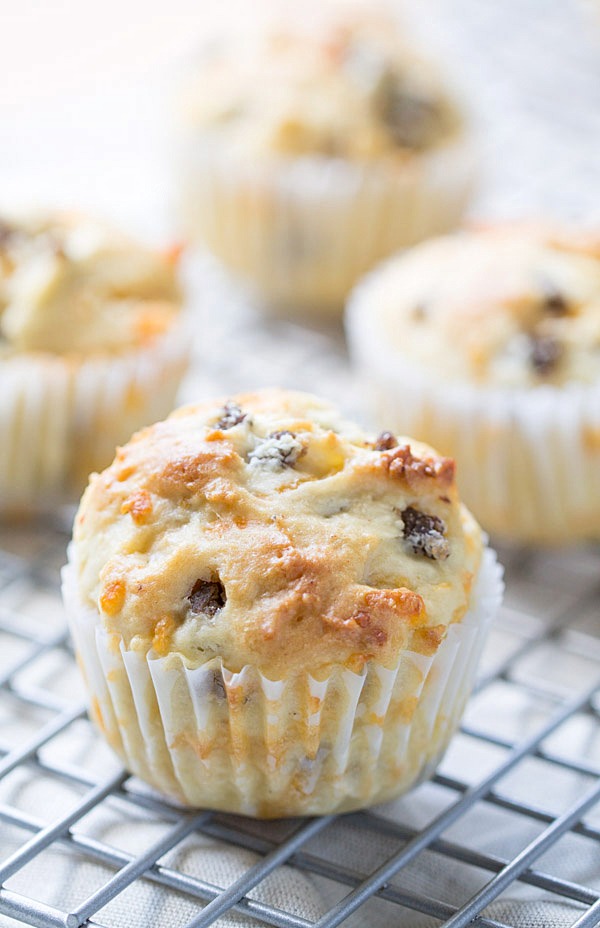 We LOVE to begin our day with these savory Sausage Cheddar and Olive Oil Muffins. Perfect for a quick breakfast or to enjoy with a cup of coffee! | This Gal Cooks #PantryInsiders