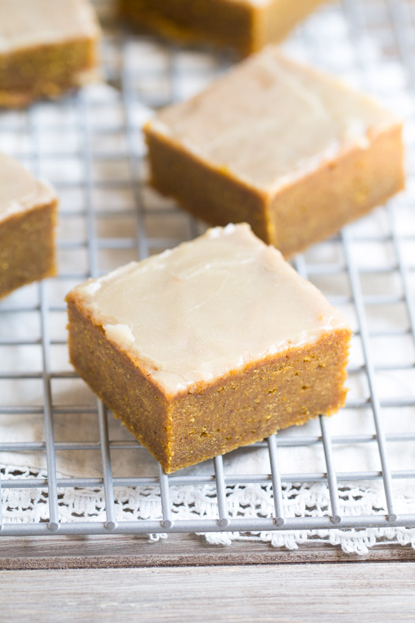 The BEST fudgy Pumpkin Spice Bars with Bourbon Butter Glaze. These melt in your mouth bars will make you swoon! | This Gal Cooks