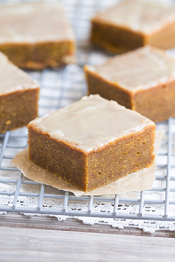 The BEST fudgy Pumpkin Spice Bars with Bourbon Butter Glaze. These melt in your mouth bars will make you swoon! | This Gal Cooks