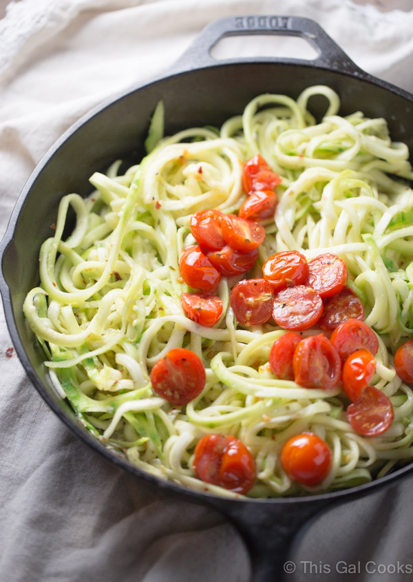 Simple and healthy, these zucchini noodles are paired with roasted tomatoes and a light white wine sauce. Cooked in one skillet to cut back on the clean-up.