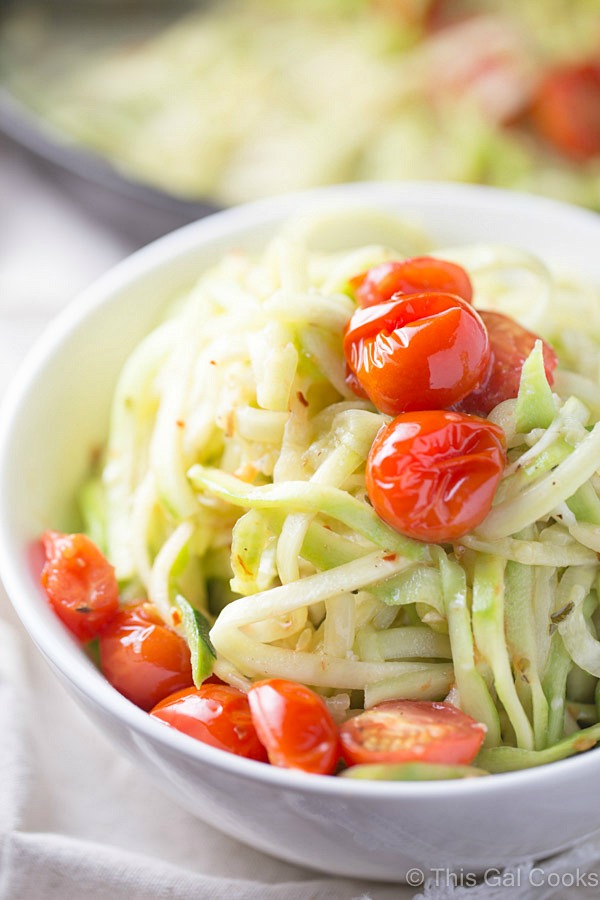 Simple and healthy, these zucchini noodles are paired with roasted tomatoes and a light white wine sauce. Cooked in one skillet to cut back on the clean-up.