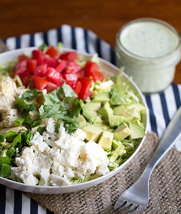 Shaved Brussels Sprout Salad with Creamy Cilantro Dressing is a simple and flavorful salad that's perfect for lunch or a light dinner. This salad is packed with chicken, avocado, tomatoes and queso fresco!