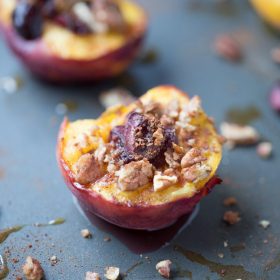 These delicious baked peaches are baked with sweet cherries, pecans, cinnamon and nutmeg and honey. Then they're topped with baked brie cheese. SO good and a healthier option for dessert, too!