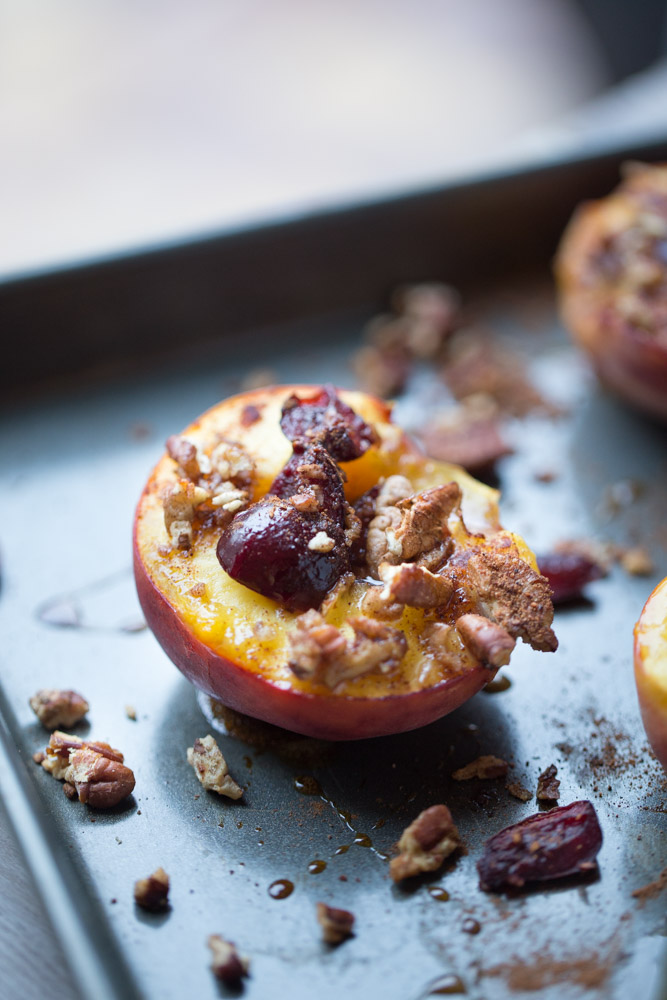 Baked Peaches with Cherries and Pecans. A healthier dessert option with under 100 calories per serving!