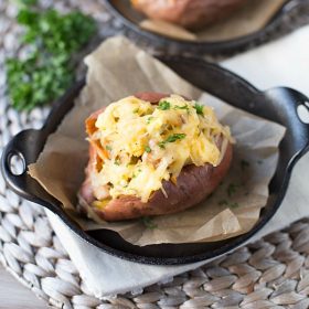 These healthier Breakfast Sweet Potatoes are stuffed with scrambled eggs, chicken sausage, and shredded smoked gouda cheese. Only 300 calories per serving, low fat and low sugar!