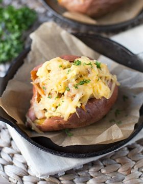 These healthier Breakfast Sweet Potatoes are stuffed with scrambled eggs, chicken sausage, and shredded smoked gouda cheese. Only 300 calories per serving, low fat and low sugar!