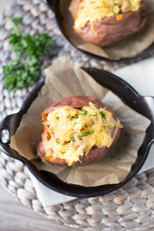 These healthier Breakfast Sweet Potatoes are stuffed with scrambled eggs, chicken sausage, and shredded smoked gouda cheese. Only 300 calories per serving, low fat and low sugar!