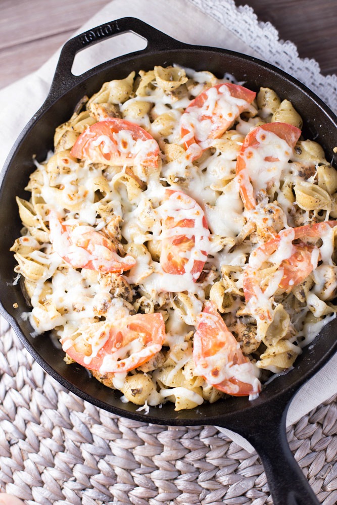 Pesto Chicken Pizza Pasta is a simple dinner recipe that uses ingredients that you may already have stocked in your pantry. This delicious dinner recipe is ready to devour in under 30 minutes!
