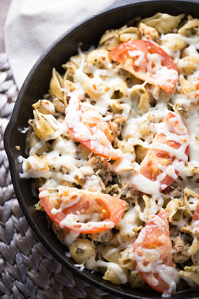 Pesto Chicken Pizza Pasta is a simple dinner recipe that uses ingredients that you may already have stocked in your pantry. This delicious dinner recipe is ready to devour in under 30 minutes!