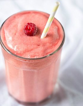 Dairy free, simple and easy to make Tropical Raspberry Coconut Smoothie | This Gal Cooks