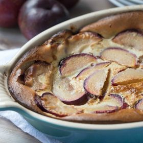 Melt in your mouth Plum Clafoutis is out of this world amazing and so easy to make, too! | This Gal Cooks