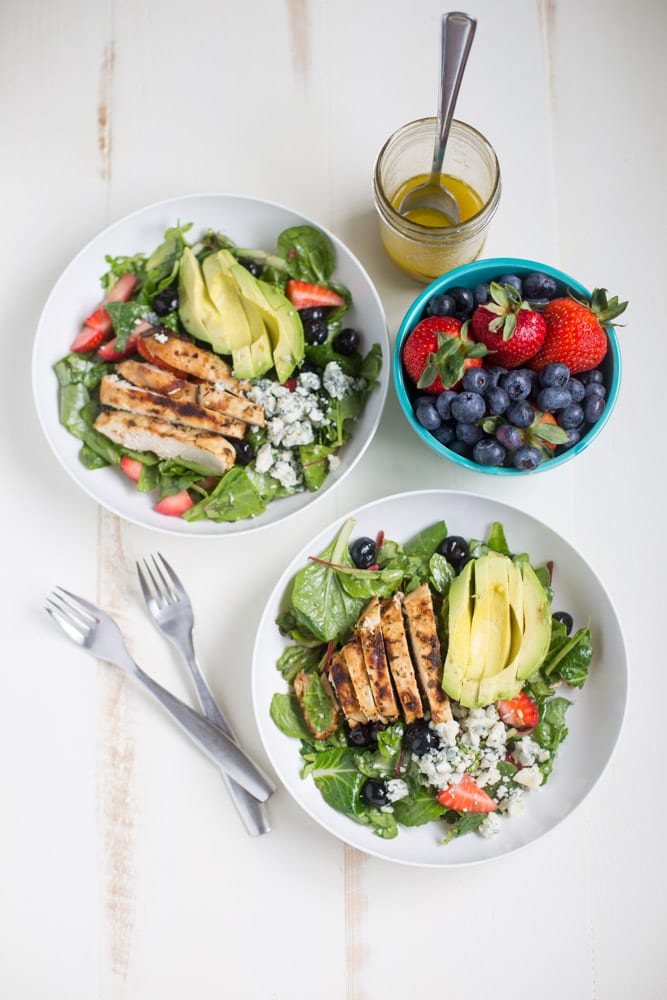 Gorgonzola Chicken Salad with Berries and Avocado is a fresh and healthy salad full of fresh fruit, gorgonzola, super greens and it's dressed with homemade honey balsamic vinaigrette!