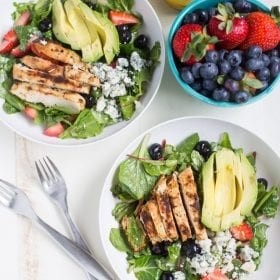 Gorgonzola Chicken Salad with Berries and Avocado is a fresh and healthy salad full of fresh fruit, gorgonzola, super greens and it's dressed with homemade honey balsamic vinaigrette!