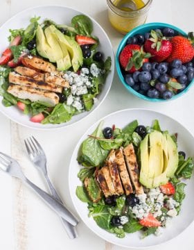 Gorgonzola Chicken Salad with Berries and Avocado is a fresh and healthy salad full of fresh fruit, gorgonzola, super greens and it's dressed with homemade honey balsamic vinaigrette!