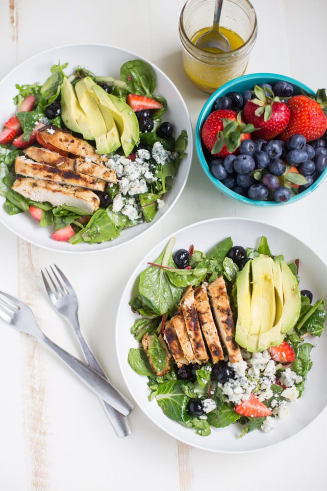 Gorgonzola Chicken Salad with Berries and Avocado is a fresh and healthy salad full of fresh fruit, gorgonzola, super greens and it's dressed with homemade honey balsamic vinaigrette!