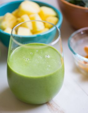 Tropical Kale Smoothie is packed with tons of healthy kale! Mango and pineapple add a bit of sweetness and tropical flavor and plain yogurt make it irresistibly creamy.