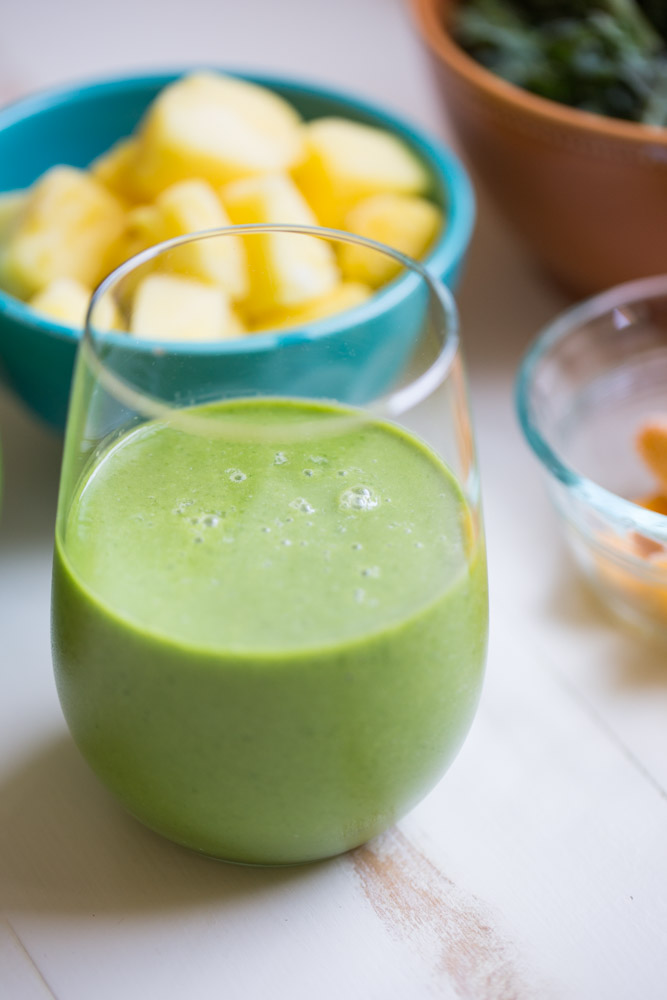 Tropical Kale Smoothie is packed with tons of healthy kale! Mango and pineapple add a bit of sweetness and tropical flavor and plain yogurt make it irresistibly creamy.