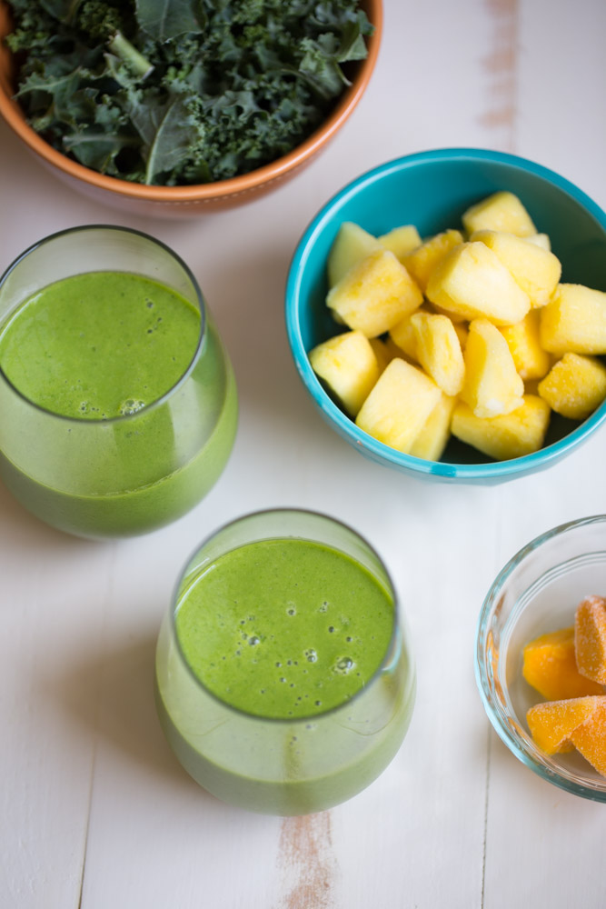 Tropical Kale Smoothie is packed with tons of healthy kale! Mango and pineapple add a bit of sweetness and tropical flavor and plain yogurt make it irresistibly creamy.