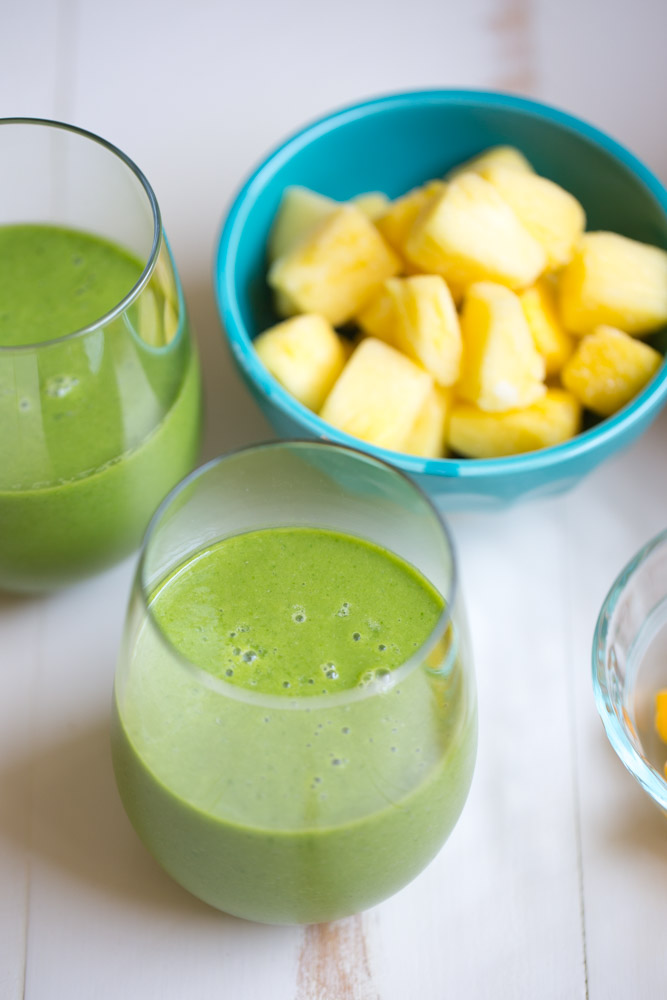 Tropical Kale Smoothie is packed with tons of healthy kale! Mango and pineapple add a bit of sweetness and tropical flavor and plain yogurt make it irresistibly creamy.