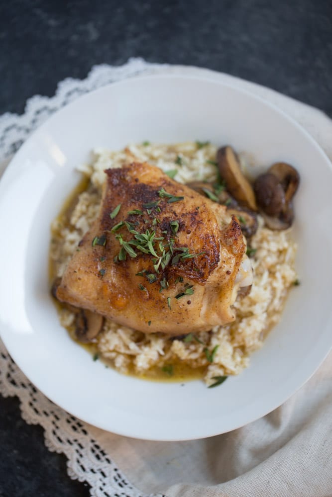 One Skillet Chicken Thighs and Mushrooms with Cauliflower Rice is an easy one skillet dinner recipe that’s ready to eat in under an hour. It’s low carb and gluten free and is made with real ingredients.