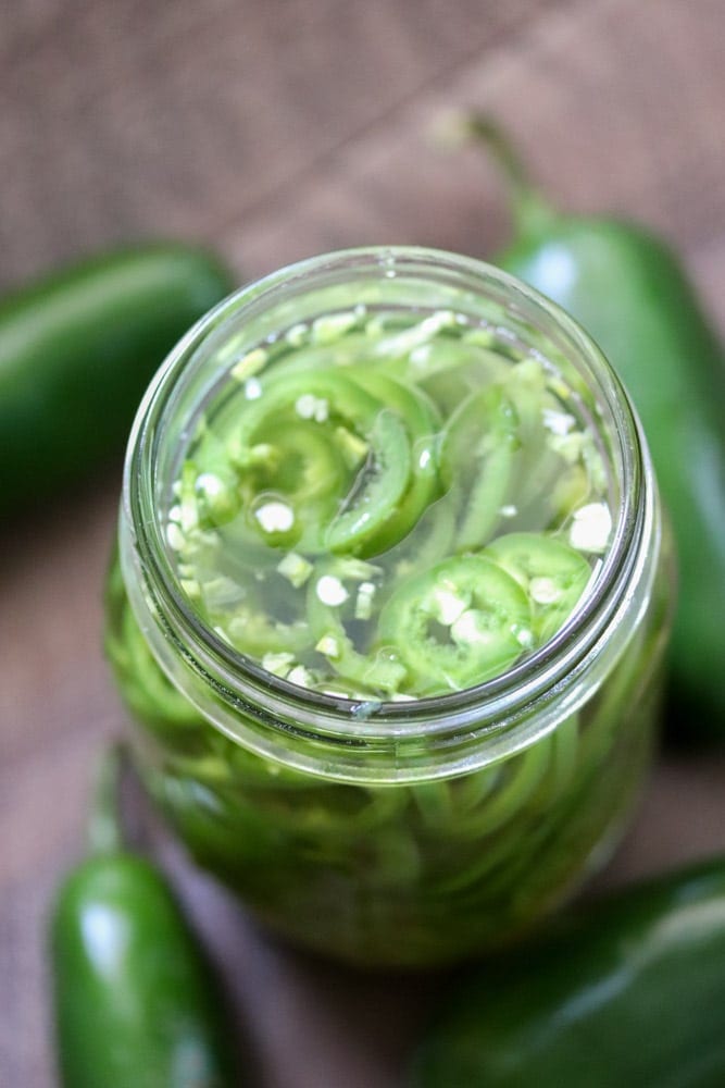 Quick pickled jalapeños are a life saver for jalapeno fans that want a pickled jalapeños right now! These pickled jalapeños are ready for use in all of your recipes in under an hour. 