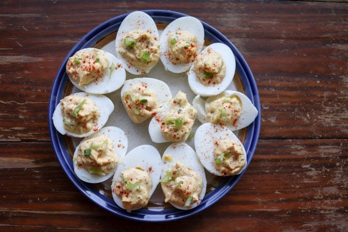 These delicious southern deviled eggs are spiced up with hot sauce and chopped jalapenos. A sure treat for anyone who loves deviled eggs!