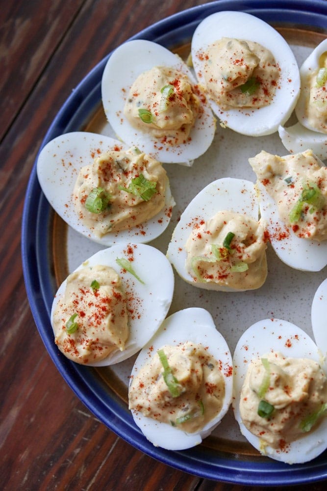 These delicious southern deviled eggs are spiced up with hot sauce and chopped jalapenos. A sure treat for anyone who loves deviled eggs!