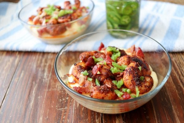 Flavorful blackened shrimp and grits made with smoked gouda cheese are a perfect quick and easy meal! Full of BOLD flavors. You can't beat a bowl of creamy cheese grits topped with shrimp and bacon.