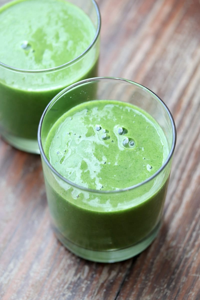 This healthy, nutrient dense paleo and Whole30 compliant mango pineapple kale smoothie tastes great even though there's a lot of something you may not like in it - kale!