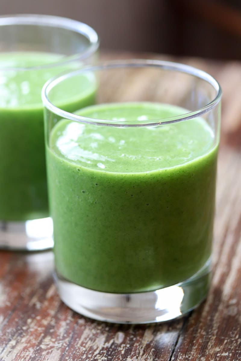 This healthy, nutrient dense paleo and Whole30 compliant mango pineapple kale smoothie tastes great even though there's a lot of something you may not like in it - kale!