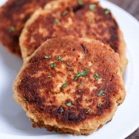 The easiest salmon cakes you'll ever make! These paleo salmon cakes are made with canned salmon, paleo mayo, spices, and almond flour! Serve them as an appetizer or with your favorite veggie for a complete healthy meal. #paleo #salmon #savory #dinner #appetizer