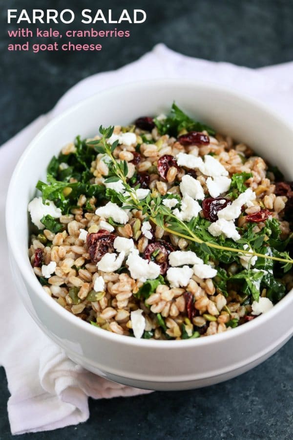 Tender farro, nutrient dense kale, tart cranberries, creamy goat cheese and a delicate lemon herb dressing. This Farro Salad is irresistibly delicious! #vegetarian #salad #kale #healthy