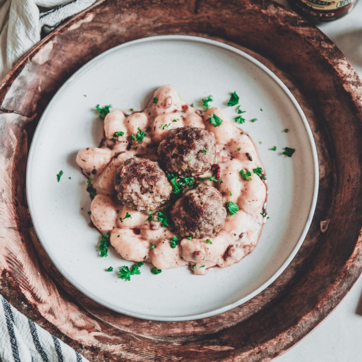 Baked Pesto Pork Meatballs with Creamy Gnocchi